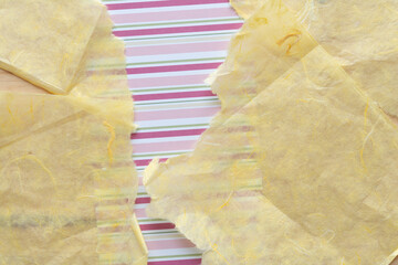 Canvas Print - yellow tissue paper with torn edges on scrapbooking paper with stripes in pink and green