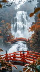 Wall Mural - A breathtaking waterfall in autumn surrounded by red leaves and a red bridge. 