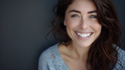 Big bright white smile headshot with a beautiful brunette woman sincere happy cheerful positive expression. 