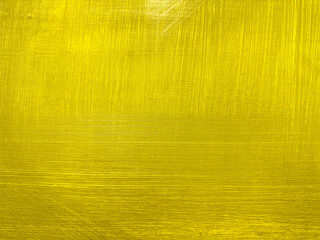 Wall Mural - textured yellow painted background with brush strokes on canvas.