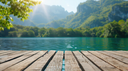 Poster - Sunlit wooden dock overlooking a serene lake surrounded by lush green mountains, perfect for nature lovers and outdoor enthusiasts.