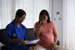 © kiattisak - Pregnant women in Asia Have your doctor do a pregnancy test. Doctors will perform scans and x-rays to determine if the fetus is a girl or a boy at the hospital. Mom is worried.