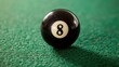 © chanidapa - Close-up of black eight ball on green billiard table, poised for a decisive winning move