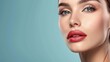 © Kharkovich - Close-up portrait of a woman with red lips and blue eyes on a blue background