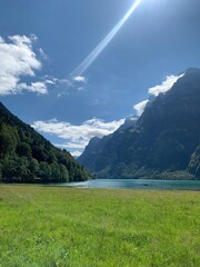 Wall Mural - Klöntalersee, Glarus, Switzerland - alpine lake on a sunny day, swiss alps, beautiful idyllic