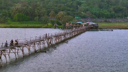 Wall Mural - View of Ong Cop bridge or Tiger wooden bridge, Vietnam's longest wooden bridge in Chi Thanh district, Phu Yen province, Vietnam. Travel and landscape concept.