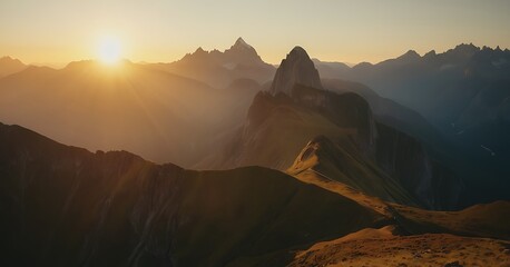 Wall Mural - The sun rising over a majestic mountain range, casting golden hues across the peaks and valleys.