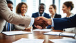 © FreemiumStock - Successful Business Negotiation Concluded with a Handshake in the Boardroom