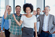 © peopleimages.com - Team, business people or success with fist pump in office for win, collaboration or celebrate with smile. Group, portrait or achievement with inclusion or support in company, staff with hands for yes