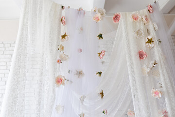 Canvas Print - White lace texture curtains with floral abstract pattern with spring flowers levitate. Summer pink peonies flowers levitating, hanging flowers on a white background, copy space. Template, mockup.	
