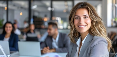 Poster - Workstation in a modern bright office occupied by an enthusiastic young woman.