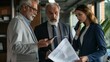 © Nicholas - Three professionals in business attire are focused on reviewing documents and using electronic devices in a well-lit office, engaging in productive teamwork and communication.