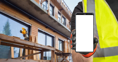 Poster - Construction template. Phone mock up. Smartphone in hand of builder. Phone with blank white screen. Place for construction application. Construction worker demonstrates cellphone. Copy space