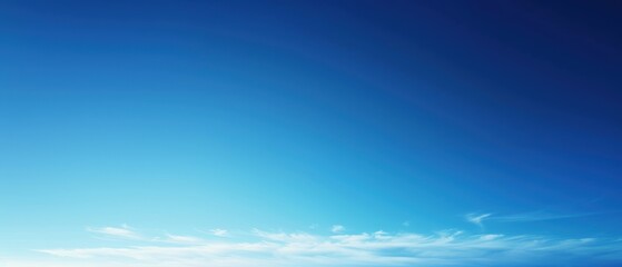 Wall Mural - A vibrant blue sky with delicate wispy clouds stretching over a clear horizon.