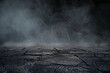 © alexandr - dark and cracked ground with a misty background creating a mysterious and eerie atmosphere suitable for horror or post-apocalyptic themes