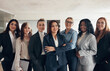 © Flamingo Images - Diverse group of smiling businesswoman standing in a office conference room