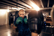 © Flamingo Images - Mature man doing a punching workout in a boxing gym with a partner