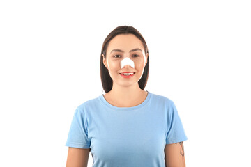 Wall Mural - Happy young woman with bandaged nose on white background. Plastic surgery concept