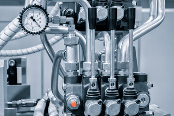 Aufkleber - Part of a hydraulic industrial machine, control levers of a hydraulic machine, industrial concept