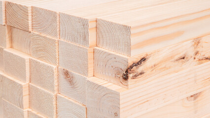 Poster - A stack of wooden planks with a few of them having a few scratches on them. The wood is light brown in color