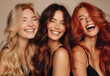 © Zita Stankova - Three smiling models with red, burnette and blonde hair