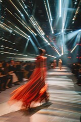 Poster - A woman wearing a red dress walks down a catwalk, likely for a fashion show or event