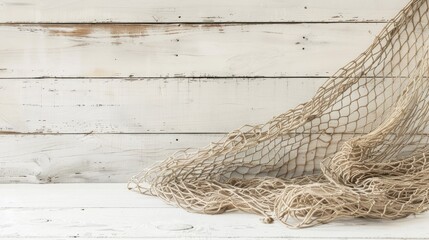 Sticker - Artistic photograph of vintage fishing net on white wooden backdrop with empty space