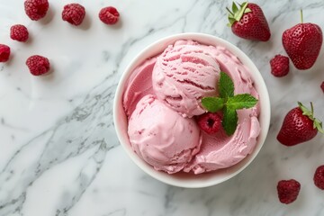 Sticker - Top view of strawberry ice cream scoops garnished with mint in a bowl, surrounded by fresh berries