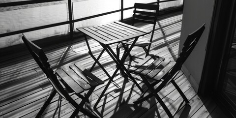 Poster - A classic table setting with chairs in a simple black and white color scheme, great for minimalist designs or vintage inspired projects