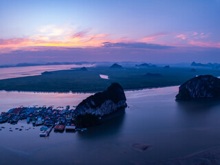 Poster - Landscape Aerial view of majestic clouds in the sky sunset or sunrise over sea with reflection in the tropical sea.Beautiful landscape scenery.Amazing light of nature Landscape nature background