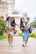 © Masakazu Tokashiki - Two 30-something Indian Malaysian mothers with their 7-year-old son and 5-year-old daughter walking happily together in front of a Western-style historical building in Kuala Lumpur, Malaysia.