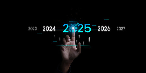 Countdown to 2025 concept. the taps a virtual download bar with a loading progress meter on New Year's Eve, turning the year 2024 to 2025.