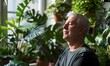 © simba kim - Old man resting with eyes closed among green plants indoors, Generative AI