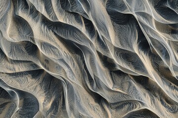 Wall Mural - close-up of abstract patterns in sand, created by the wind and waves