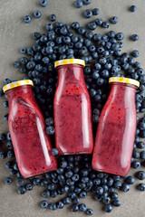 Blueberries smoothies in bottles