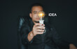 © NOTE OMG - Creative idea. Concept of idea and innovation, Businessman holding light bulb. Idea concept with innovation and inspiration for business or education, Creative thinking and learning.