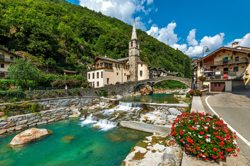 Wall Mural - Small town and alpine river in Aosta Valle, Italy.