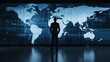 © Achirawee - A silhouette of a manager stands before a large screen displaying global shipping routes, representing the interconnectedness of supply chains, with space for copy.