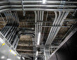 © Cavan Images - Electrical conduit in computing center