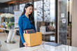 © Charlie's - Quit Job asian business woman sending resignation letter and packing Stuff Resign Depress or carrying business cardboard box in office. Change of job or fired from company