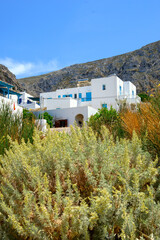 Wall Mural - Greek holiday houses on a hillside in Aegiali on the island of Amorgos. Cyclades, Greece