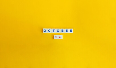 Wall Mural - October 16. Text on Block Letter Tiles on Yellow Background. Minimal Aesthetics.