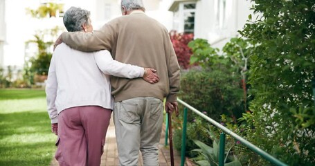 Wall Mural - Back view, senior couple and walk in backyard for love, retirement and hug for date together. Smile, elderly man and woman in garden of nursing home for support in nature for anniversary and wellness