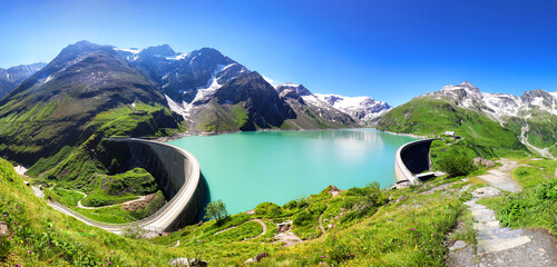 Poster - Austria - green mountain lake with dam near Grossglokner. Mosserboden dam and alpine peaks in the background .Panorama view of Stausee Wasserfallboden, Hohe Tauern Alps