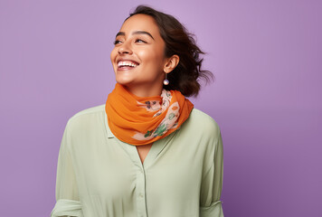 Wall Mural - A Woman With An Orange Scarf Smiling Against A Purple Background, Expressing Joy And Confidence