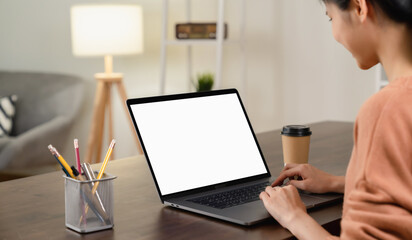 Aufkleber - Woman hand using laptop and type on the keyboard, Mockup screen of advertisement.