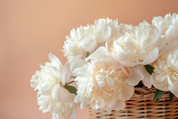 Poster - A closeup photo showcases a basket overflowing with white peonies, the flowers arranged in a beautiful display against a soft, pastel peach background