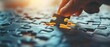 © Purichaya - Close-up of hand placing puzzle piece, highlighting business strategy, collaborative solution concept