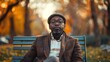 © PeopleWorker - Portrait of sad expression sitting in park black man, professional costume at busy blurred park background