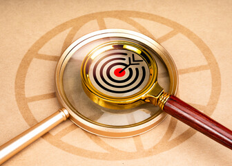 Poster - Worldwide web browser, digital data online global searching, seo and marketing concepts. Target icon in small magnifier lens stacked on big magnifying glass with world symbol on brown background.